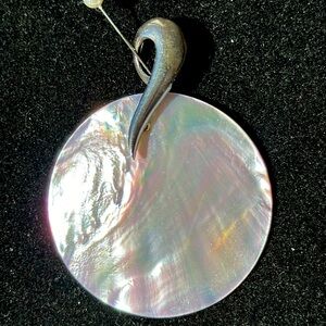 Necklace accent in mother Pearl, circular with a silver tone design to attach
